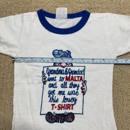 80s Kids Toddler Baby Vintage T-Shirt “Grandma & Grandad went to Malta and all they got me was this lousy T-Shirt” White Short Sleeve T-Shirt 1-2T
