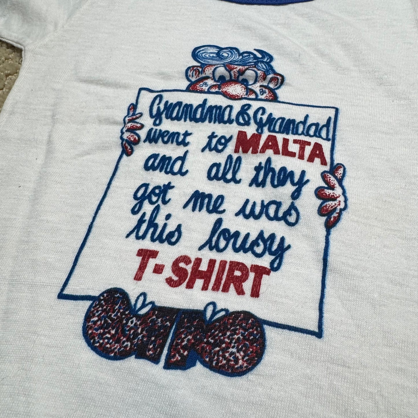 80s Kids Toddler Baby Vintage T-Shirt “Grandma & Grandad went to Malta and all they got me was this lousy T-Shirt” White Short Sleeve T-Shirt 1-2T